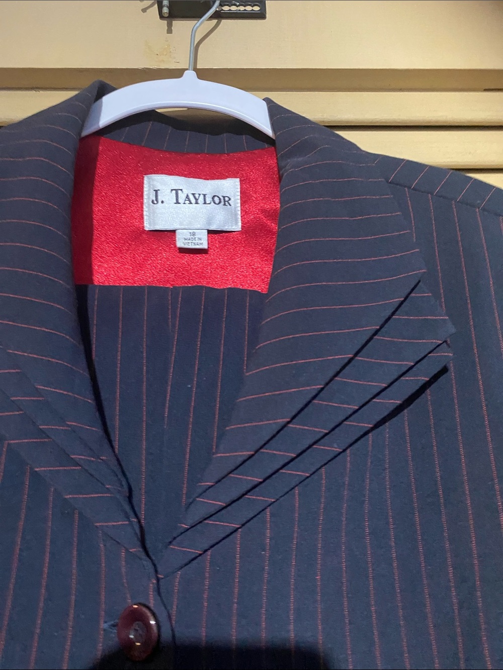 Lady’s Navy Pinstripe pantsuit w/blouse
